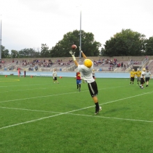 A player attempts to haul in a pass during drills as East High School Football returns to Breese Stevens Field, absent since 1975, with a scrimmage on August 8, 2015.