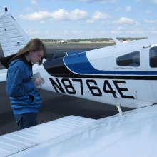 Brady Nelson takes notes during the preflight.