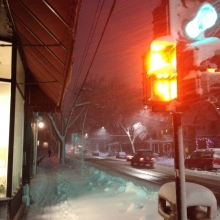 The traffic lights at Ingersoll and Willy soldier on in the face of a snowy gale.