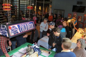 The silent auction area was crowded all afternoon.