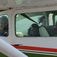 All smiles as two Young Eagles and their mother prepare to fly with pilot Bob Gilreath.