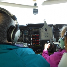 Young Eagle Pilot Bob Gilreath talks Gabrielle Masten through some straight and level flight during her Young Eagle ride on from the Dane County Regional Airport on Saturday May 11, 2013. Courtesy: Jennie Masten