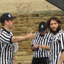 Referees discuss how the game will be called.