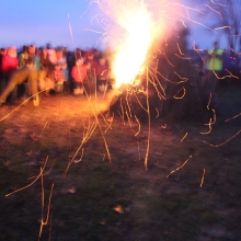 The burned pine needles squirmed like fireflies in the light onshore breeze from Lake Monona during the 2015 Winter Solstice celebration at Olbrich Park on December 22, 2015.