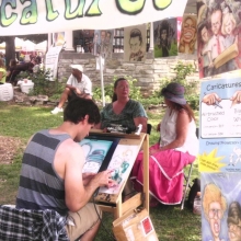 It true local festival fashion, attendees can sit for caricature sessions-airbrushed or black and white the Orton Park Festival, August 25, 2012.