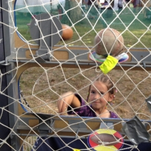 A young girl hits the mark dead-on in the Kids Games area of the Orton Park Festival on Sunday, August 26, 2012.