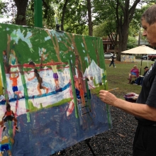 Local artist and art teacher Dan Slick completes a watercolor depicting the playground at Orton Park Festival on Sunday, August 26, 2012. 