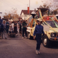 The Willy Street Fair Parade, circa 1985. An earlier incarnation of the Jim Wildeman's Bubblemobile still retains the iconic bubble smokestacks. The author is pedaling furiously in the homemade pedal car. Courtesy: Richard and Judith Guyot.