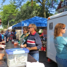 Members of the Hash House Harriers Running Club act as volunteer servers at a beer station at the Willy Street Fair, September 14, 2014.