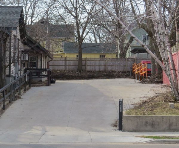 A view of the houses on Jenifer Street from the sidewalk in front of Plan B. The Lee-Skaggs house is the yellow one on the left, the Gallo house is on the right.