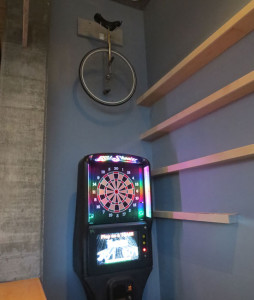 Dart board and unicycle. What bar doesn't have this?