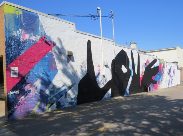 Michael Owen's 22nd Baltimore Love Mural adorns the east side of Plan B Nightclub.