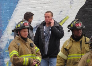 Plan B Owner Corey Gresen  (Center) after a fire damaged the nightclub Tuesday December 23, 2014.