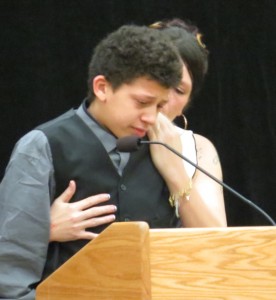 Andrea Irwin comforts her son Jordan Robinson, 15, as he speaks about his brother Tony.